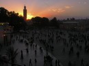 Sunset over Djemaa el-Fna * Sitting in a cafe above the Djemaa el-Fna, we watch the sun setting behind the Koutoubia Minaret. * 576 x 431 * (53KB)